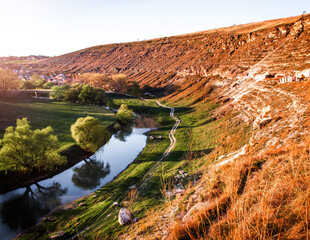 Beautiful landscape of summer hills with river in Moldova, Old Orhei. Zigzag river flows between...