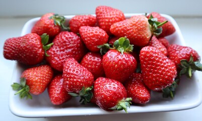 nice and juicy strawberries in a white bowl