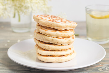 Stack of pancakes baked with elder flower.