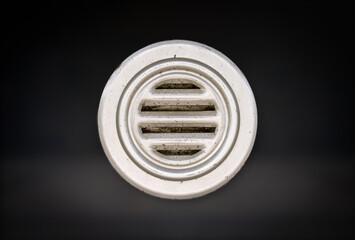 Close up of speak-thru grill or talk through grill. Front view, textured metal. Used for audible, safe and secure voice transmission for a  box office intercom or ticket window intercom.