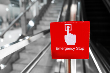 Big red escalator emergency stop button close up