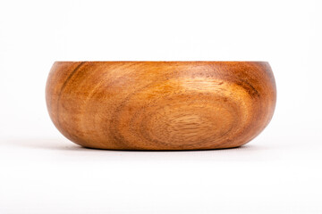 wooden bowl on white background. front side
