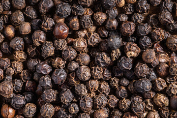 Black pepper closeup. Food background.