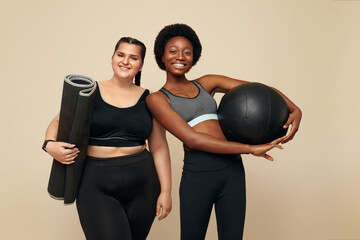 Workout. Diversity Women Portrait. Multi-Ethnic Slim And Plus Size Models Against Beige Background....