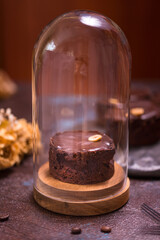 Chocolate tart, baked desert filling over a pastry base with nuts