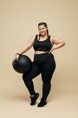 Fitness Girl. Plus Size Model With Pilates Ball Full-Length Portrait. Smiling Full-Figured Woman In...