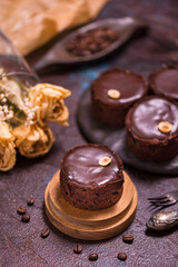 Chocolate tart, baked desert filling over a pastry base with nuts