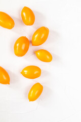 yellow fresh organic tomatoes pattern on a white background
