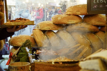 Traditional Polish round bread at a Christmas Market stall in Krakow, Poland. Traditional Polish street food.                           