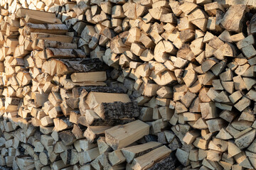 wood stacked in a woodpile to dry