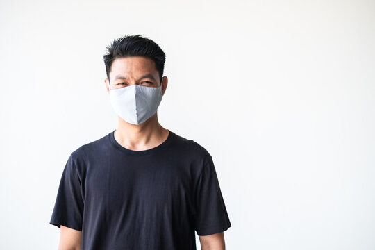 Portrait Of Young Asian Man With Homemade Fabric Mask