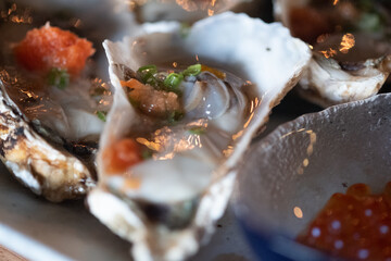 Fototapeta na wymiar Fresh​ oysters in Japanese restaurant