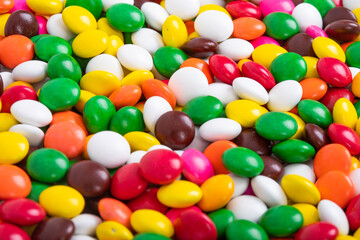 Fototapeta na wymiar Huge pile of colorful coated chocolate candies background