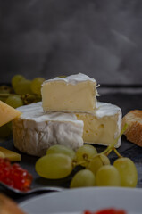 Camembert cheese with grapes