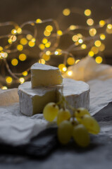 Camembert cheese with grapes