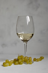 a glass of white wine with cheese Camembert