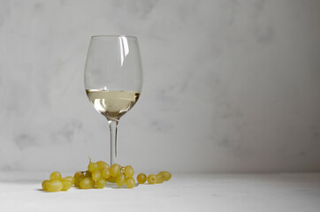 a glass of white wine with cheese Camembert