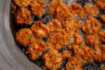 Making delicious fried fish cake in hot oil. The name of this menu is Tod Mun Pla Krai.