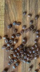 Coffe at old desk. Beans of roasted coffe  © Mateusz