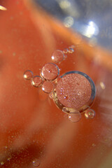 Transparent air bubbles on the orange-blue gradient background