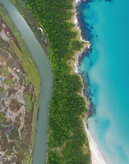 Aerial view of a river around the sea coast

