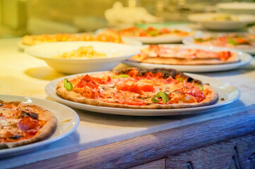 Homemade pizza with tomato and cheese on the table