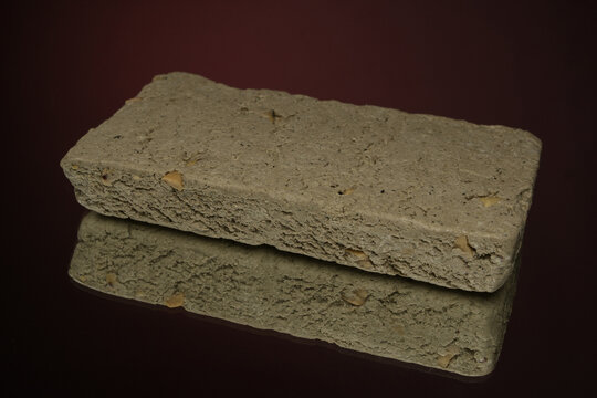 sweet halva isolated on red background
