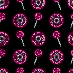 Seamless pattern with neon donuts and lollipop on black background. Candy, bakery, sweets, girly concept. Vector 10 EPS illustration.