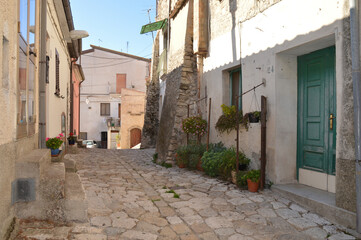 A narrow street between the old houses of San Marco dei Cavoti, a medieval village in the Campania region.