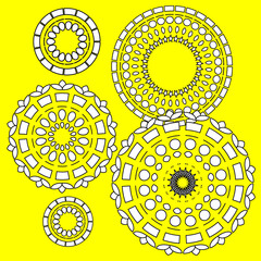 round lace ornament on yellow background