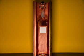 presentation of old glass bottle and unbranded wood