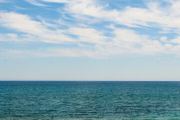 Obraz premium The universal concept of summer: blue sky and the peaceful sea