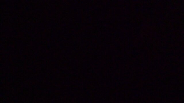 Hacker concept using a computer with stong lighting and dramatic impression