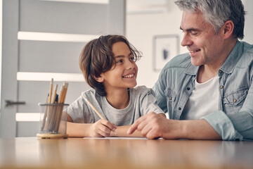 Fototapeta premium Son spending time with dad at home