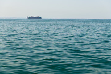 Aegian Sea win a ship on the background in Thessaloniki, Greece