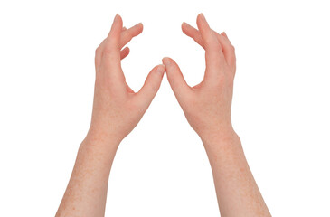 Freckled white hands, held apart, fingers gently curled, palms together.  Female hand isolated.  Hand casting a spell or prayer gesture
