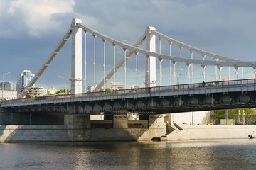 Obraz premium Moscow cityscape in spring sunset. Beautuful Krymsky bridge with right geometry. Little traffic. Coronavirus pandemic. Calmness and softness in the nature.