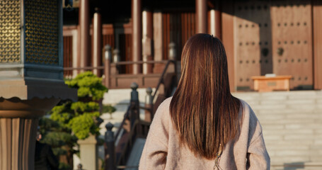 Woman visit traditional Chinese temple