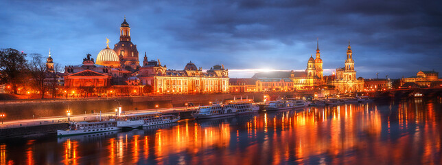 Fototapeta na wymiar Incredible panorimic Cityscape with reflection. Colorful sunset on Elbe river in Dresden. Beautiful Dresden city skyline during sunset old town, Dresden, Saxony, Germany Wonderful Picturesque Scene.