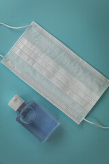 New normal safe healthy living concept mask on blue flat lay