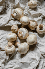 fresh champignon mushrooms on a clay plate