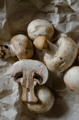 fresh champignon mushrooms on a clay plate
