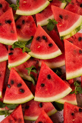 Ripe slices of watermelon as a texture, closeup background.