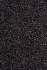 Texture of dark foam rubber closeup as background, idea