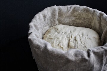 Sourdough bread dough in baking basket. High quality photo