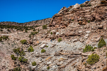 woman hiking alone in desert canyon