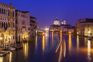 View of Venice Grand Canal and Santa Maria della Salute church in evening.