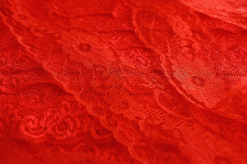 Red background from red scarlet lace guipure for sewing and decoration