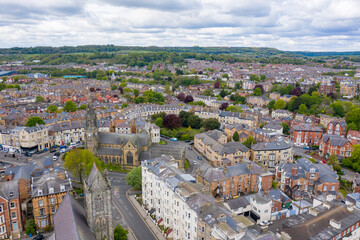 Aerial photo of the town centre of Scarborough in East Yorkshire in the UK taken from the town centre showing guest houses and hotels in the village on a bright sunny summer day