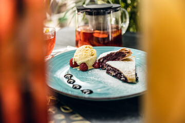 Apple strudel with ice cream and cinnamon. Baked cake, delicious dessert on the table. Top view